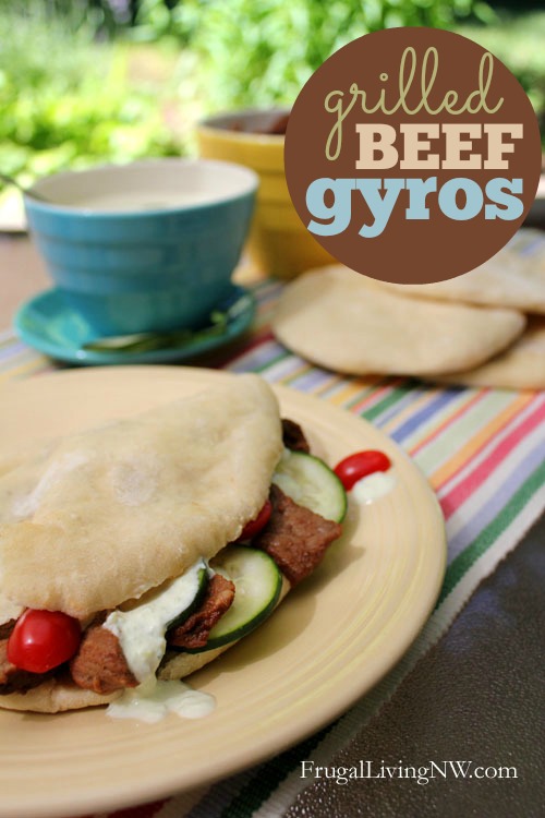 Grilled Beef Gyros: Marinaded beef stuffed in homemade pita bread with cucumber sauce. Super, super simple recipe for grilling season!